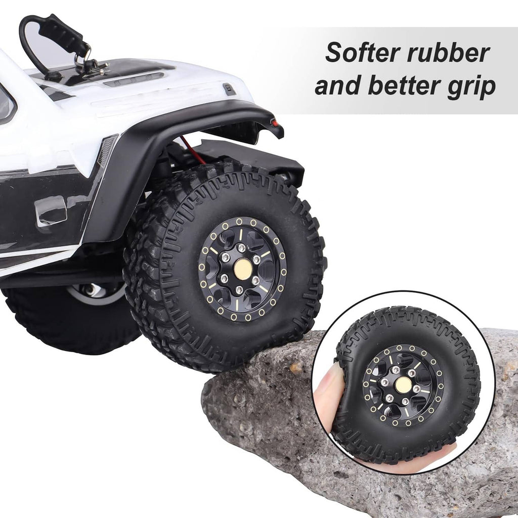 Black beadlock wheel and tire with gold center ring and bolt details