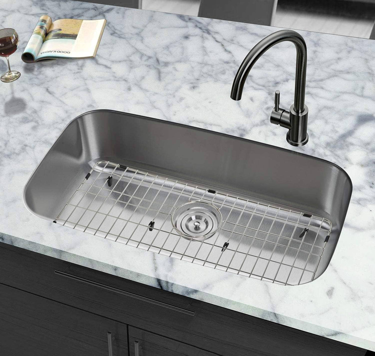 Stainless steel sink grid protector resting in sink with round drain opening
