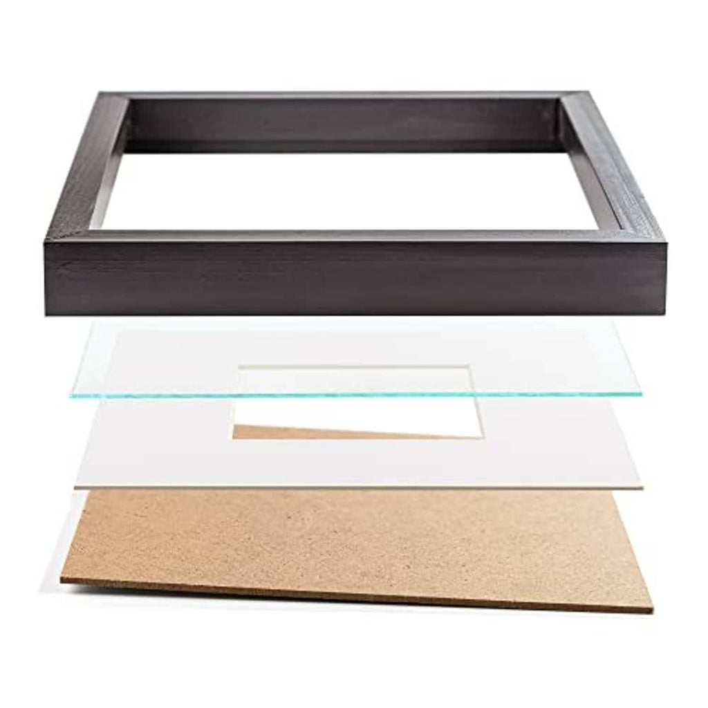 Black wooden poster frame with open back and layered insert/mat panels