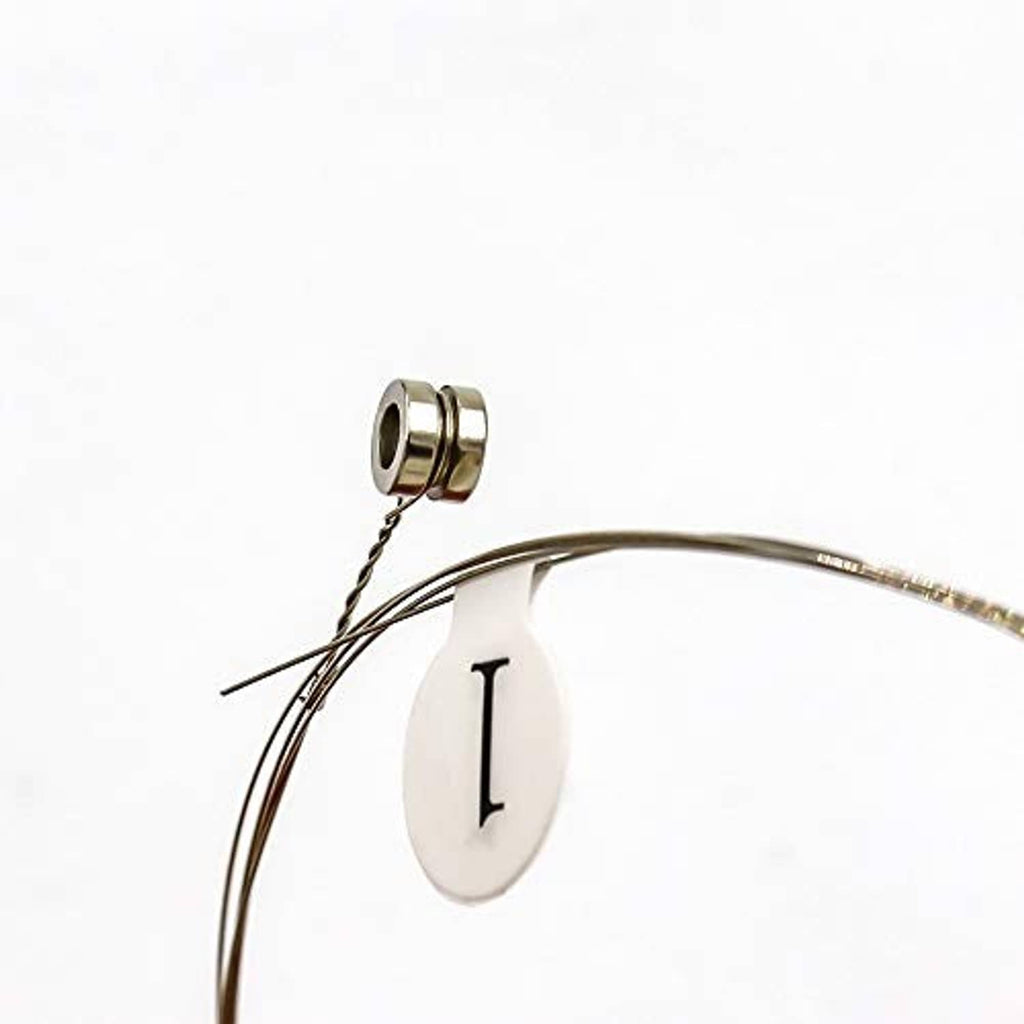 Single electric guitar string with silver ball end and winding