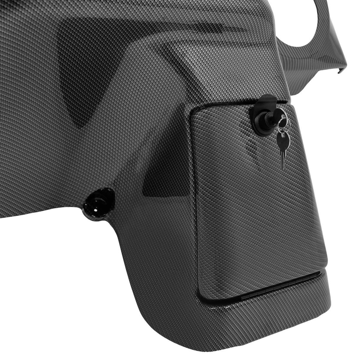 Carbon fiber style dash panel corner with key switch opening and black controls