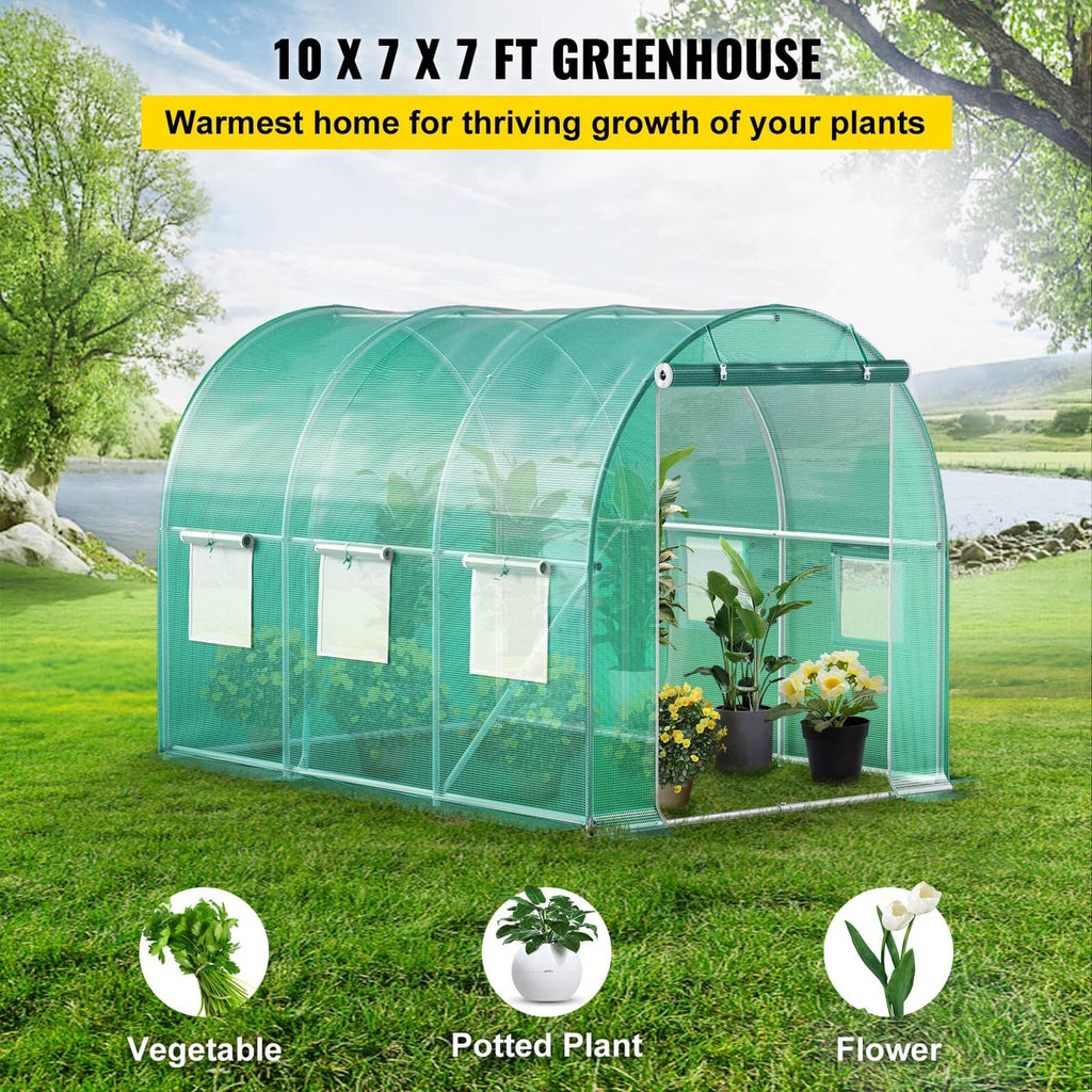 Green walk-in tunnel greenhouse with clear plastic film and framed double end door
