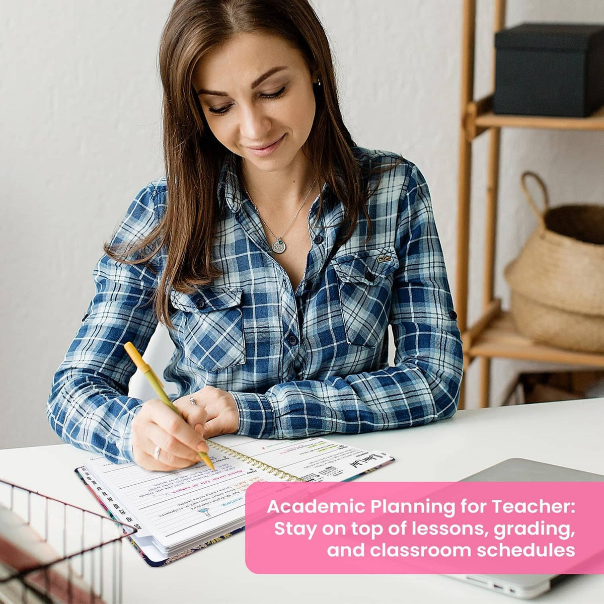 Teacher writing in an open planner showing weekly schedule pages