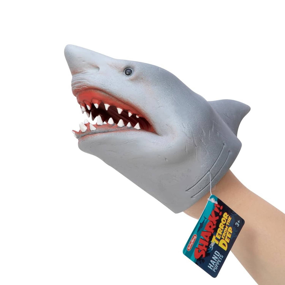Hand puppet shark with open jaws, white teeth, and gray body on wrist