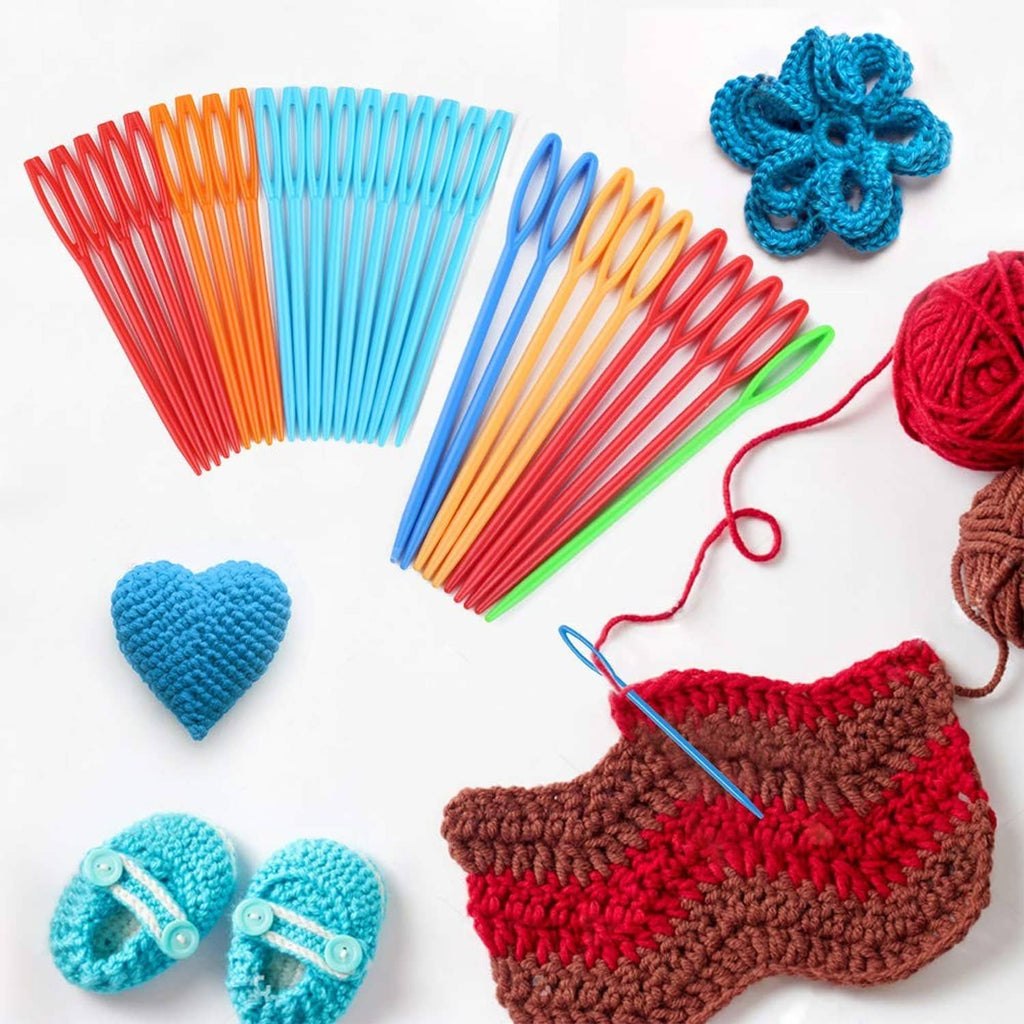 Assorted plastic lacing needles with colorful yarn and crochet pieces, craft set display