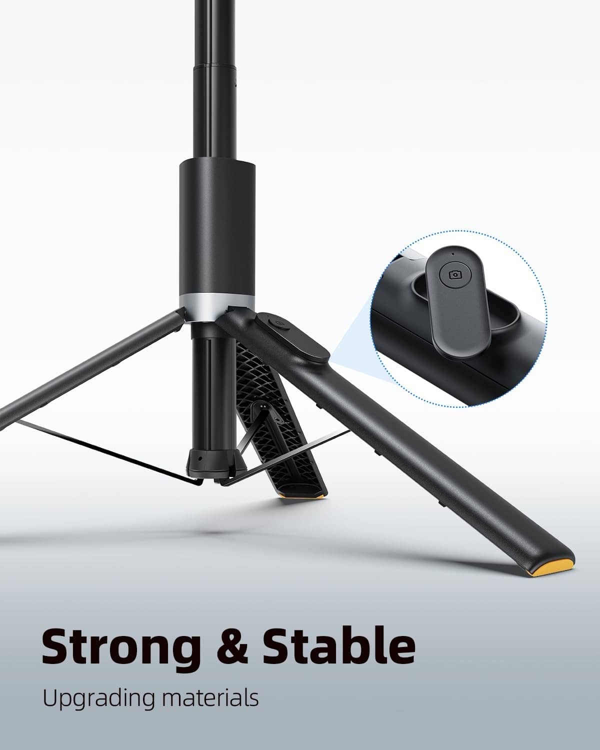 Black selfie stick tripod base with phone holder arm and wireless remote detail
