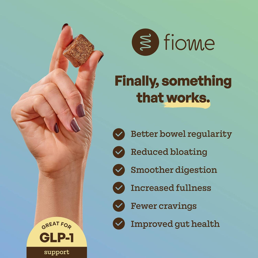 Hand holding a dark chocolate FiberBite snack