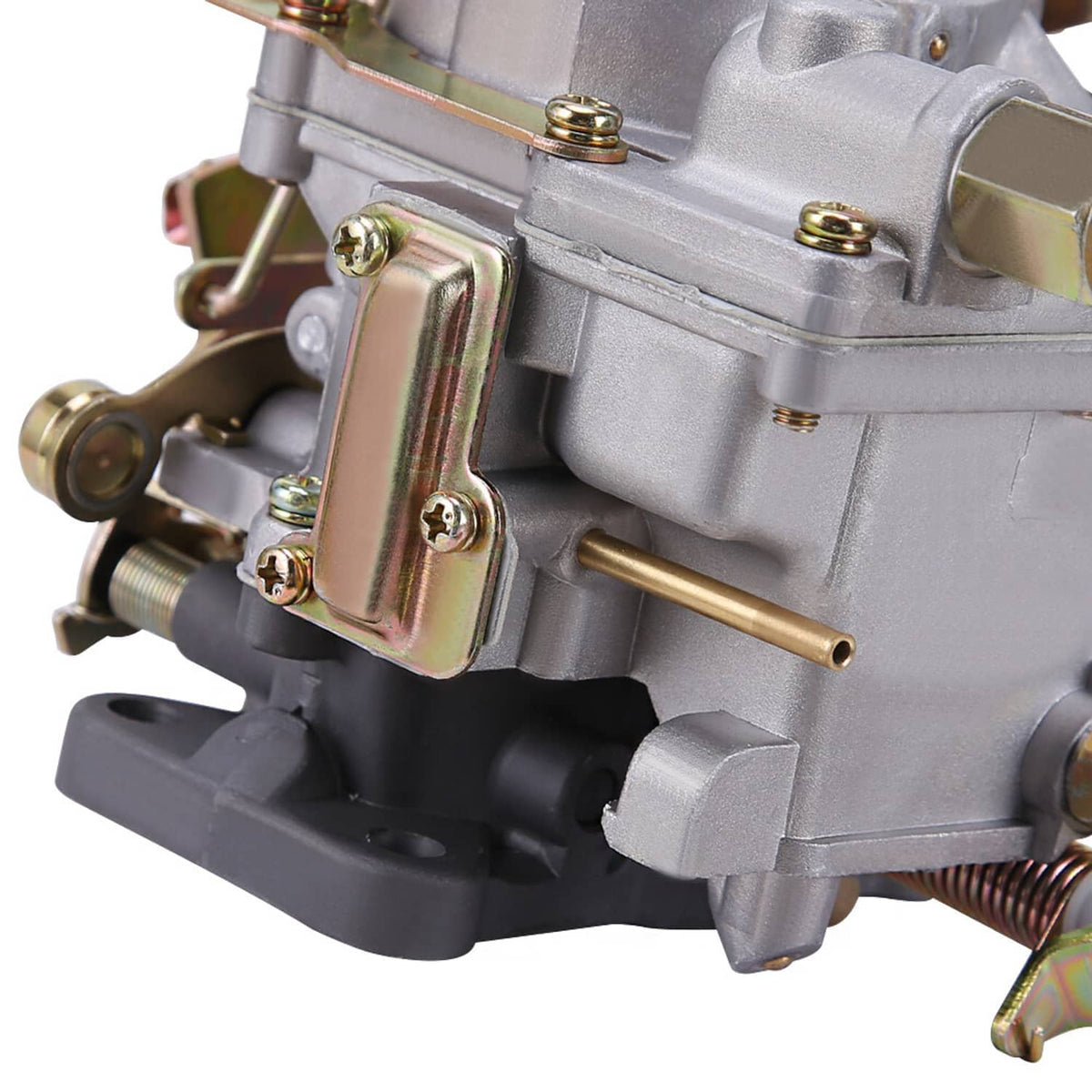 Close-up of carburetor control plate, mounting screws, and inlet tubing on silver body