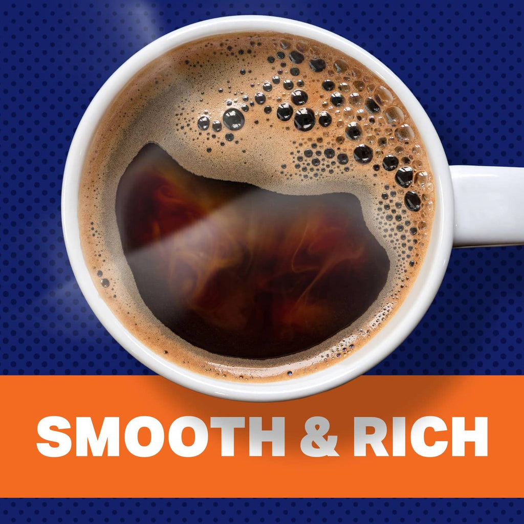 Brewed decaffeinated coffee in a white cup, with foam and dark coffee surface.