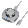Gray charging dock with circular cradle and blue indicator light, with USB-C cable