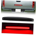Smoked red LED tailgate light bar with clear lens, black housing