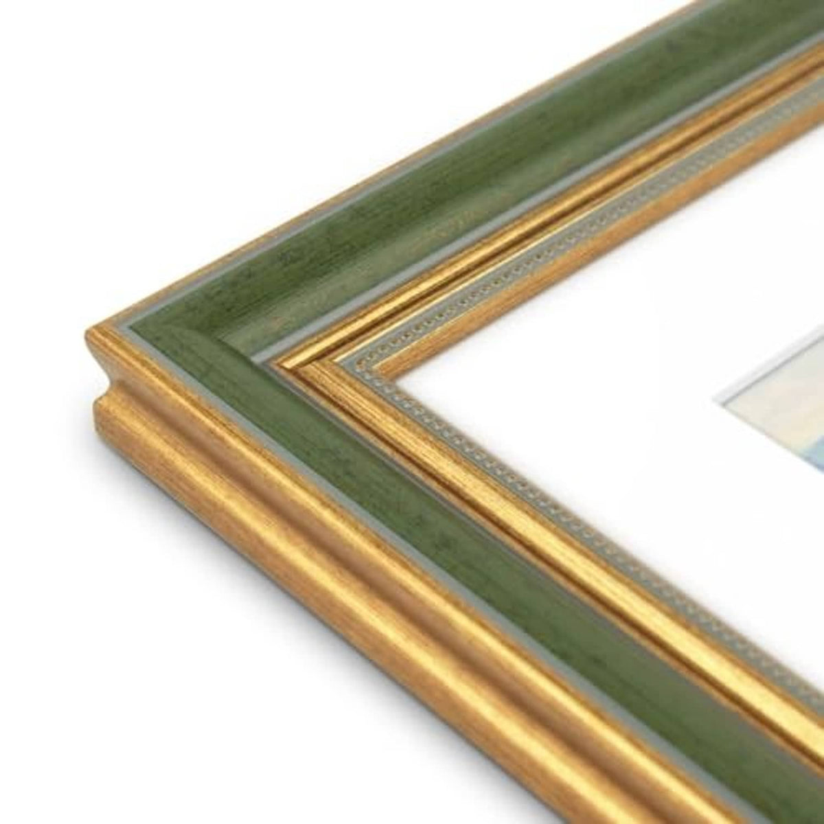 Ornate picture frame corner detail in green with gold trim and inner beaded edge.