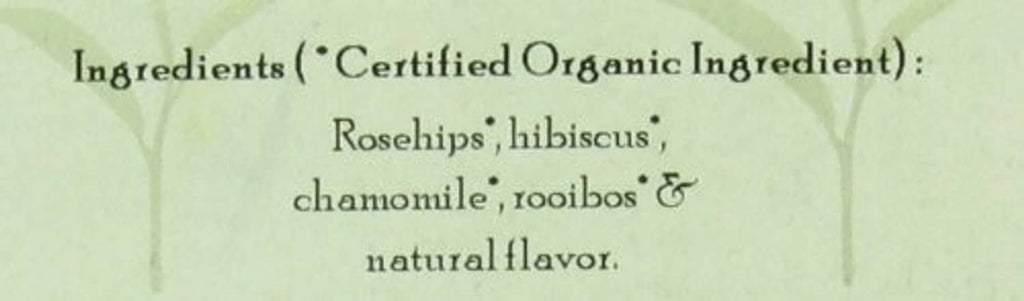 Herbal berry essence tea ingredient text close-up: rosehips, hibiscus, chamomile, rooibos