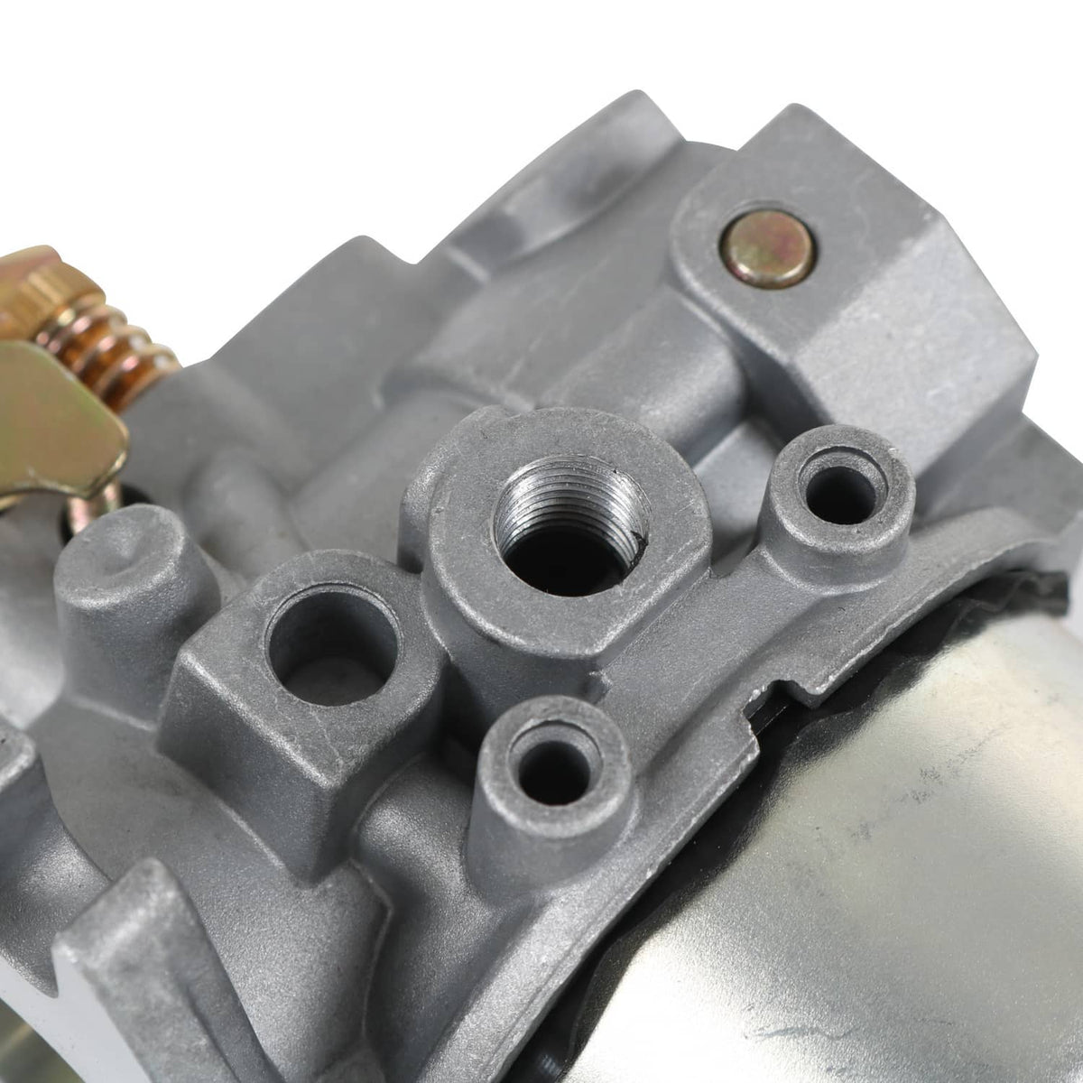 Carburetor body with ports and threaded openings, gray cast metal close-up