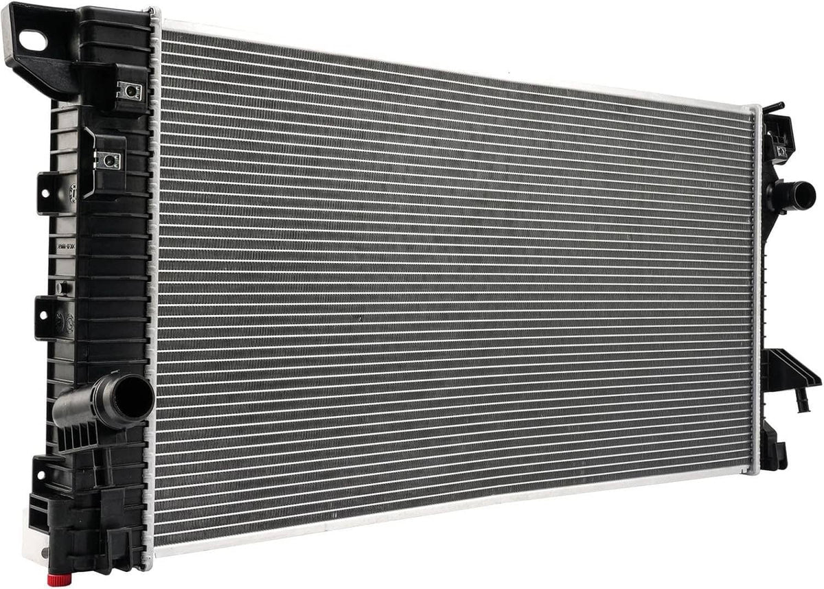 Automotive radiator with silver fin core and black plastic inlet/outlet housing