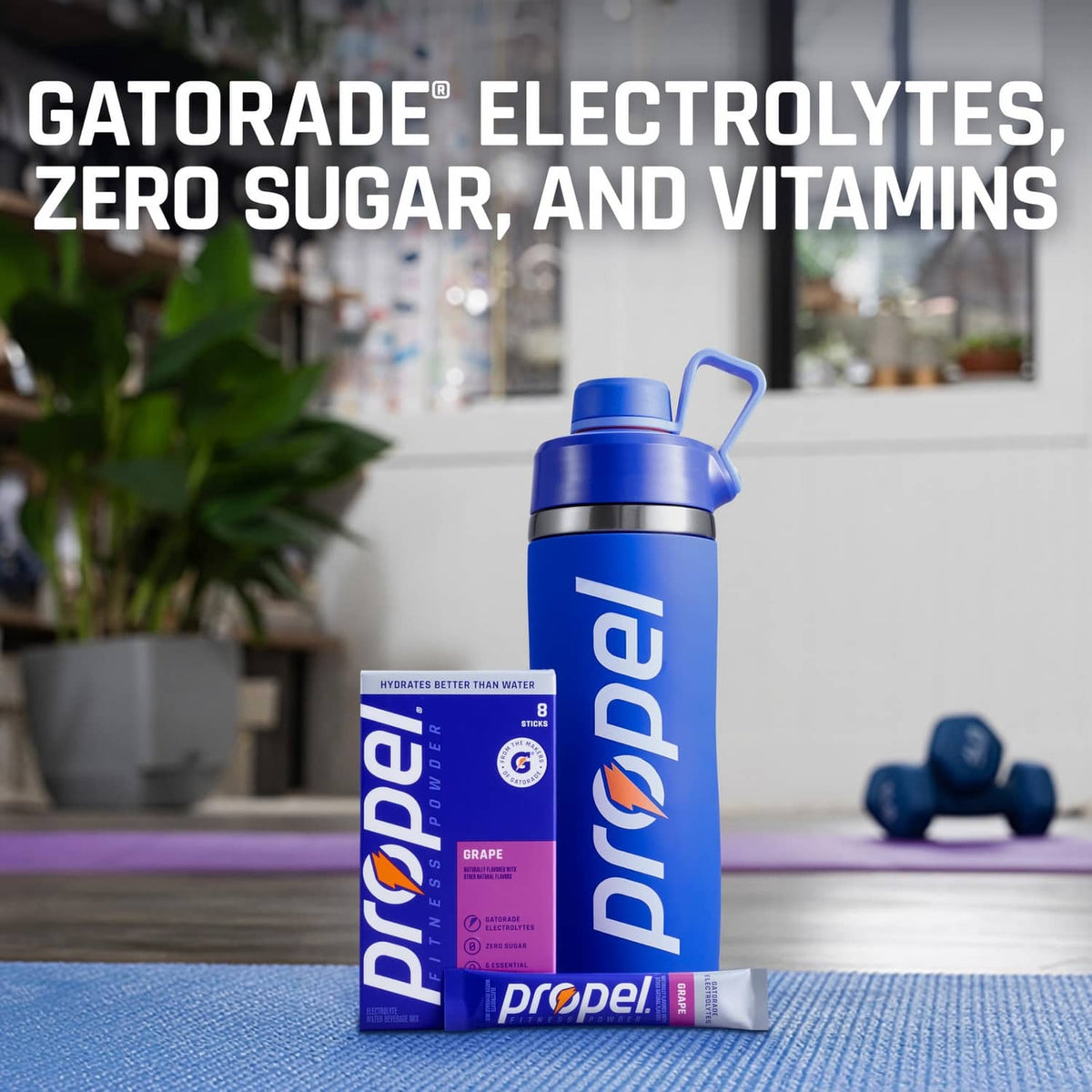 Blue Propel electrolytes shaker bottle with grape packets on a tabletop