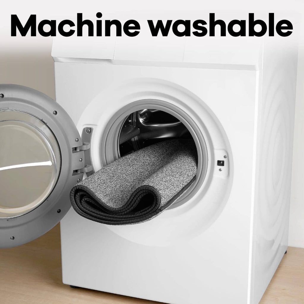 Charcoal gray runner rug inside a front-load washing machine drum