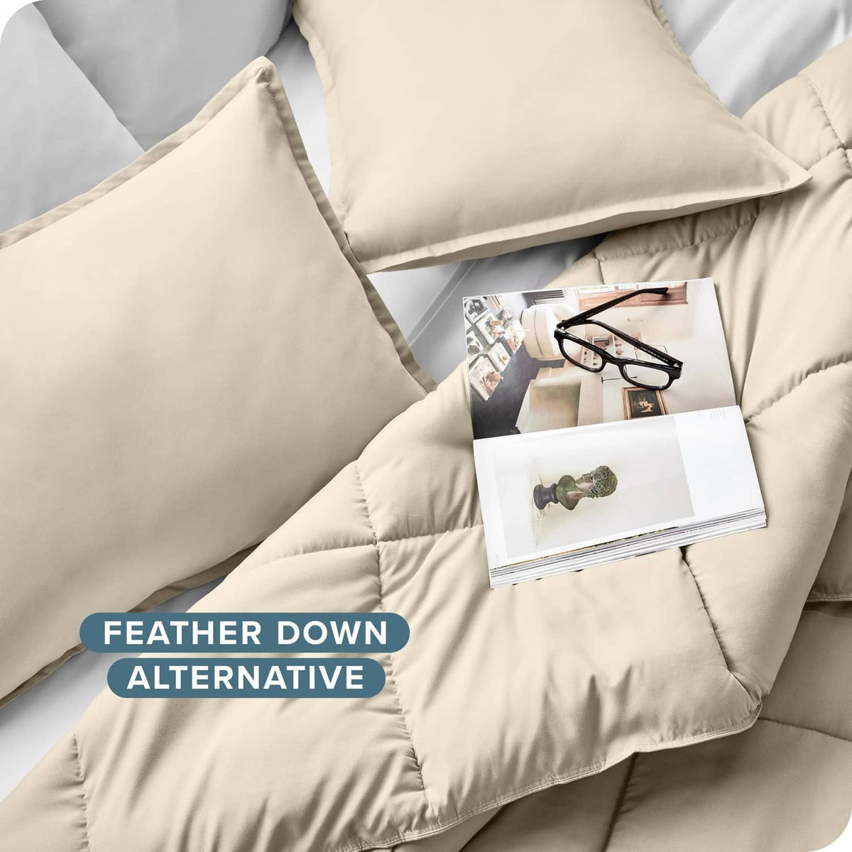 Cream quilted down alternative comforter with matching pillow shams, soft stitched corners