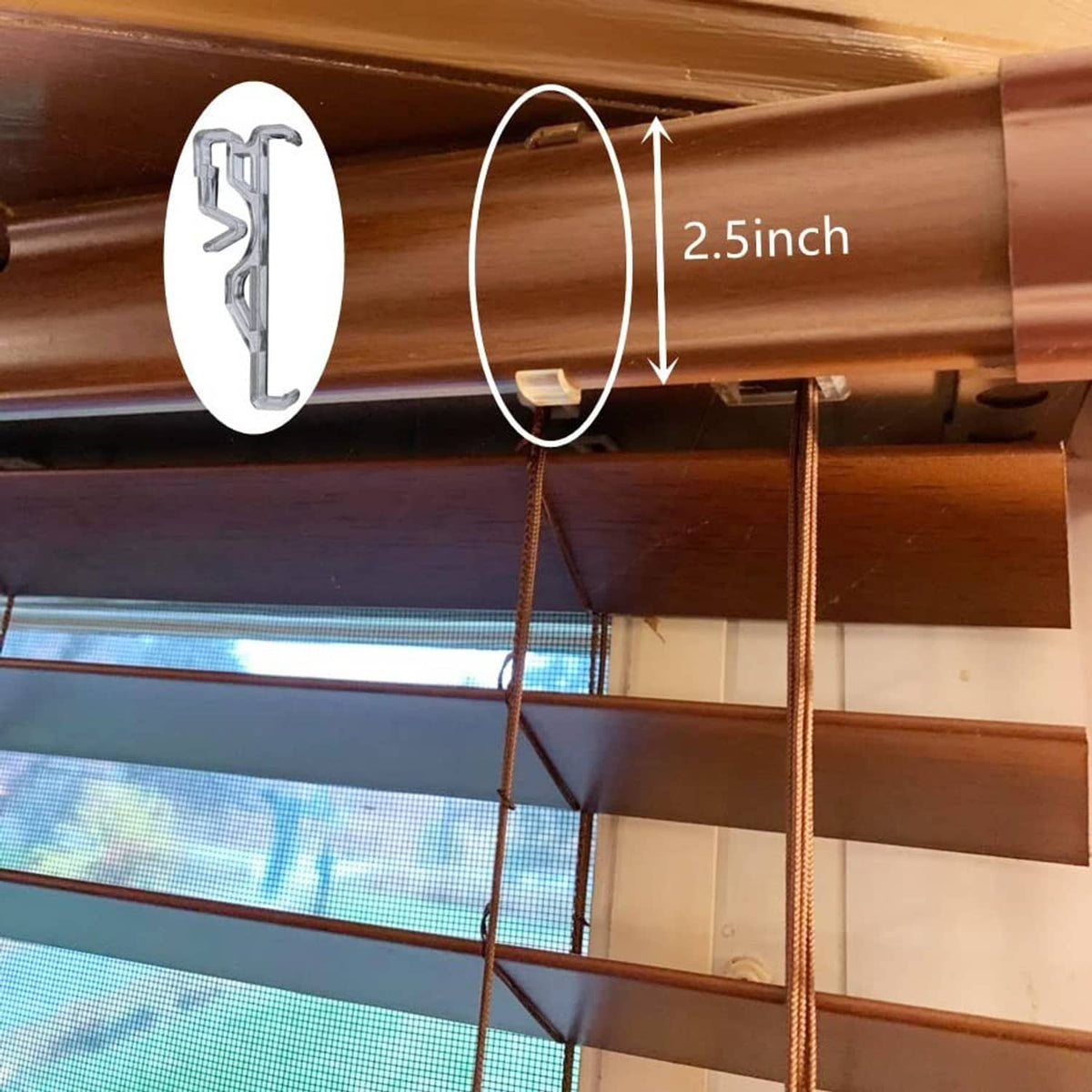 Clear plastic valance retainer clip mounted on a 2.5-inch curtain rod