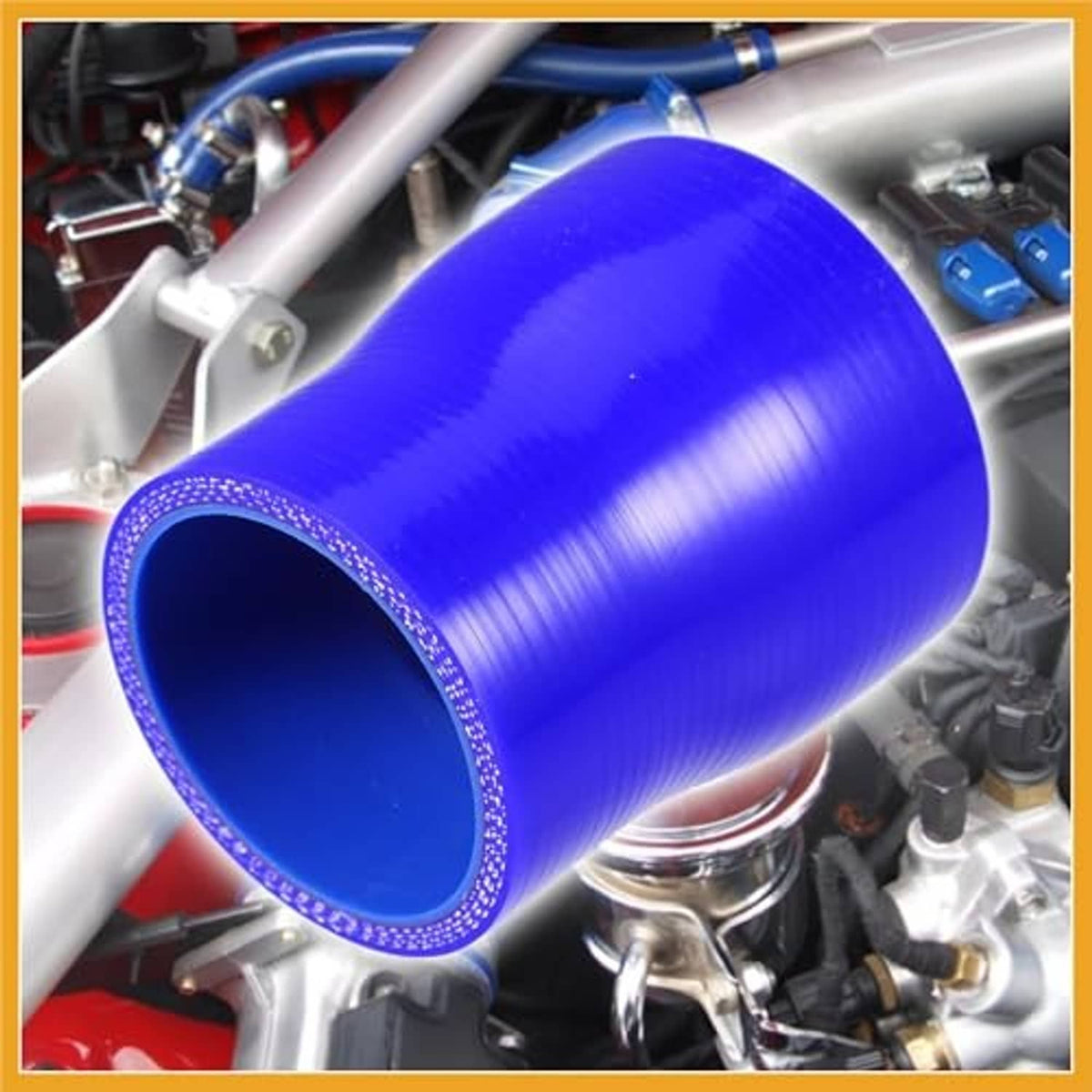 Blue straight silicone reducer hose coupler installed on engine piping