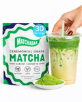 Ceremonial matcha powder bag with 30 servings and glass cup of green matcha