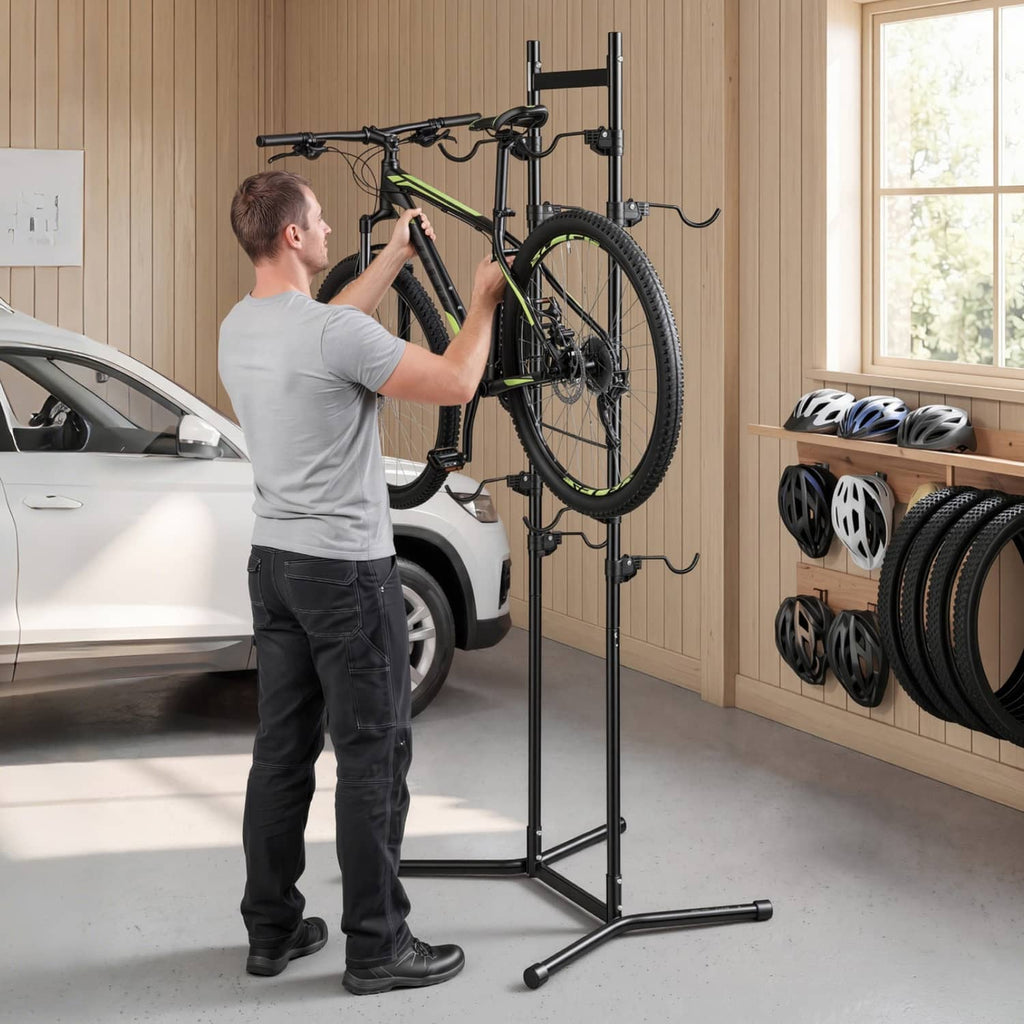 Black vertical bike rack with curved hooks holding a bicycle on steel uprights