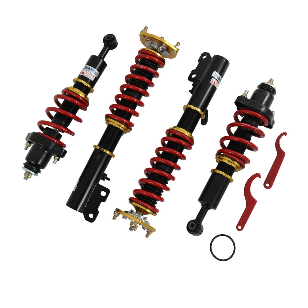Coilover strut set with red coil springs, black shock bodies, and included hardware parts
