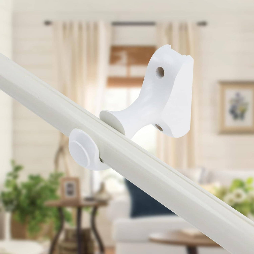 White curtain rod brackets mounted on a metal rod with hook-style ends
