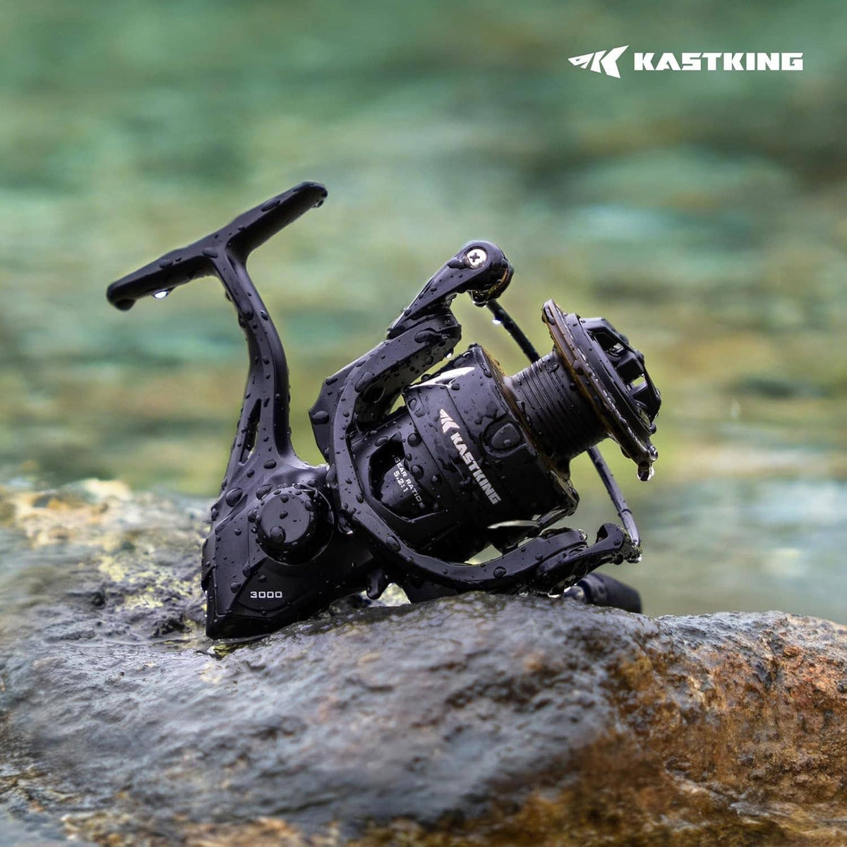 Black spinning fishing reel on wet rock with visible water droplets and handle up