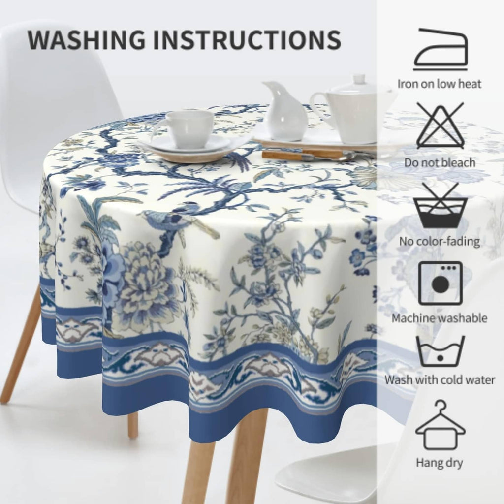 Round blue-and-white printed tablecloth on table with teacup and pitcher