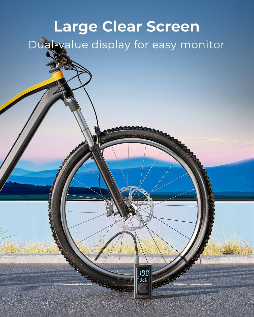 Portable tire inflator attached to bicycle wheel valve with digital pressure display