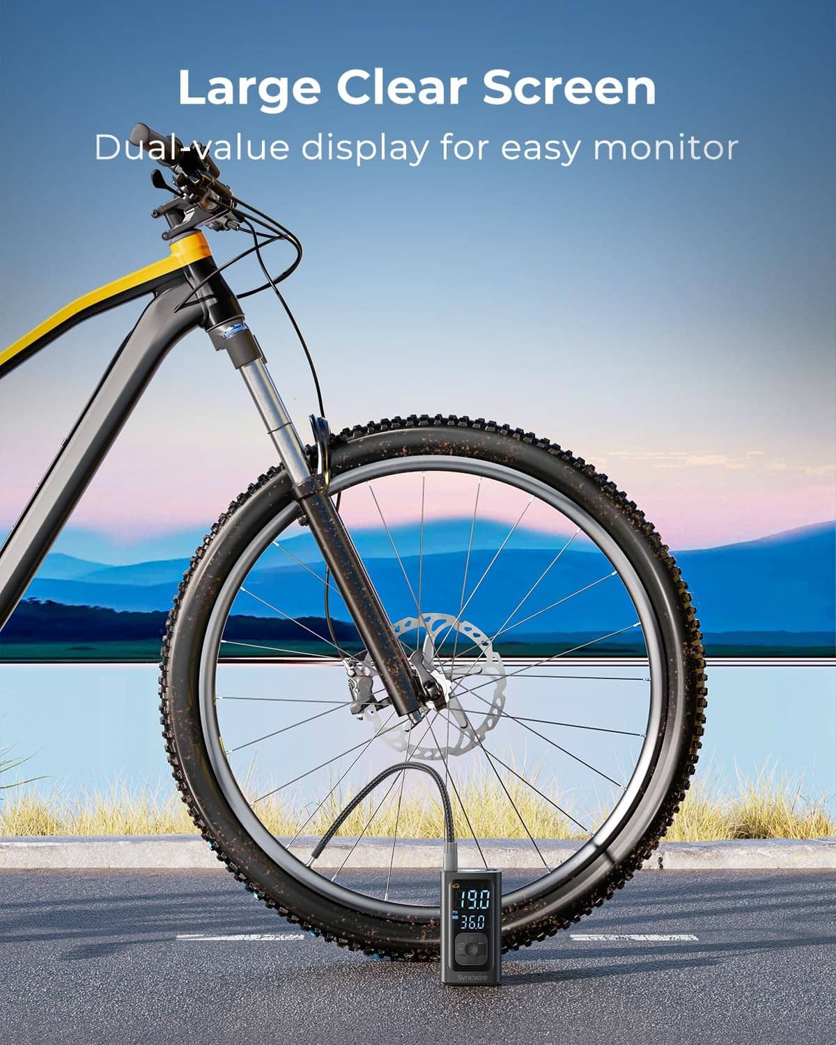 Portable tire inflator attached to bicycle wheel valve with digital pressure display