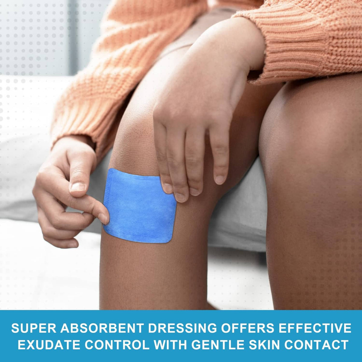Wound dressing pad applied to a leg, blue square pad for absorbent coverage