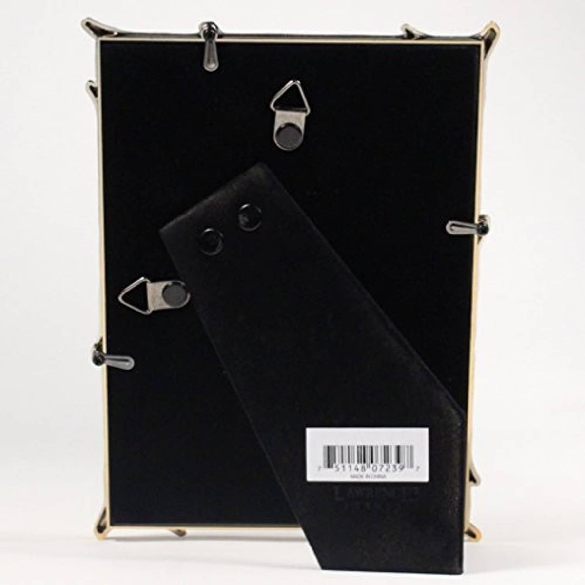 Gold metal picture frame back with black inserts and barcode label