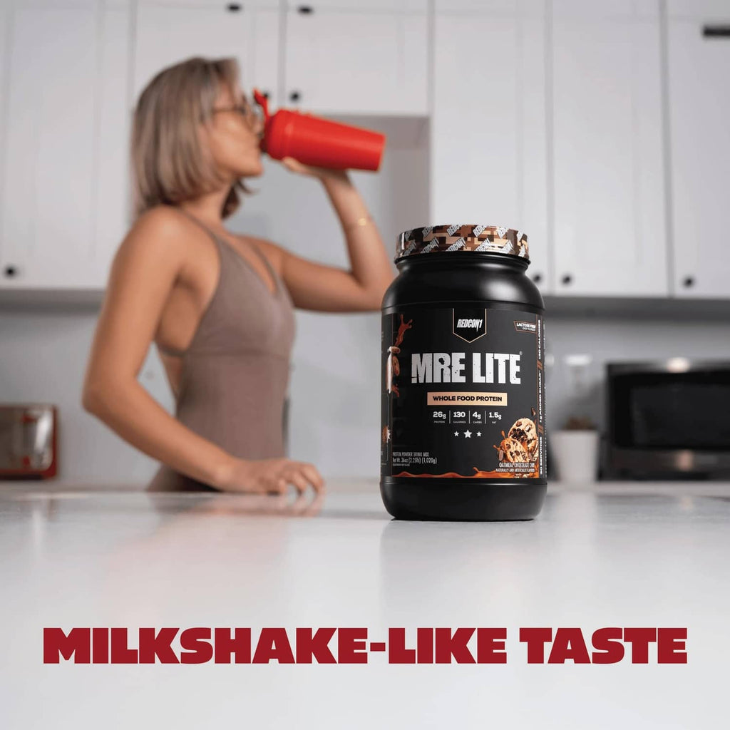 REDCON1 MRE LITE whole food protein powder tub on kitchen counter, oatmeal chocolate chip