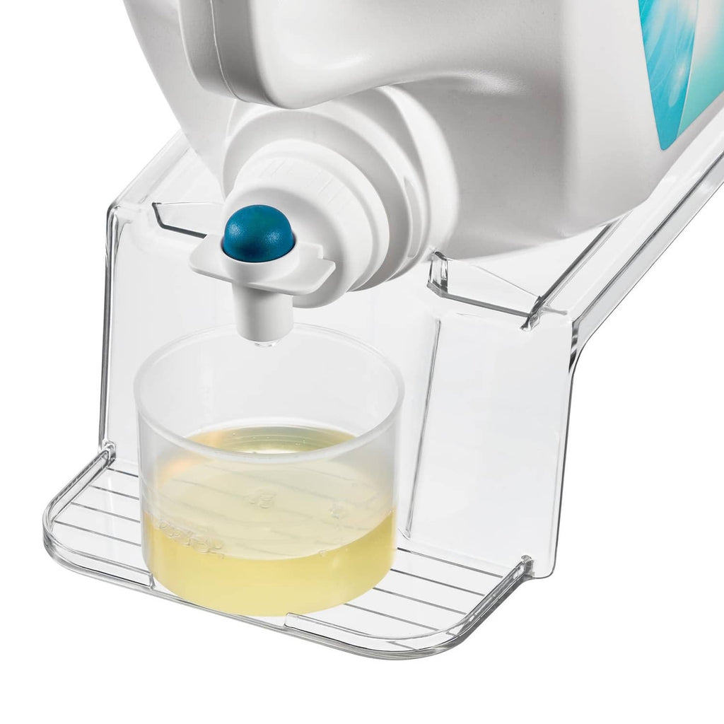 White laundry detergent holder dispensing into a clear cup with blue button spout.