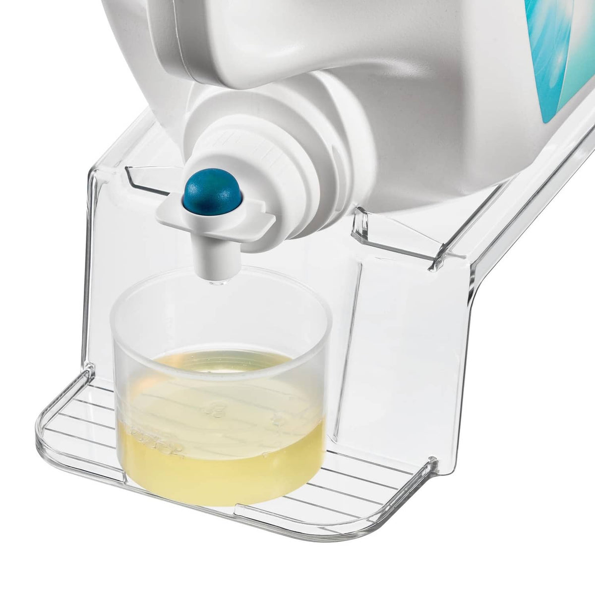White laundry detergent holder dispensing into a clear cup with blue button spout.
