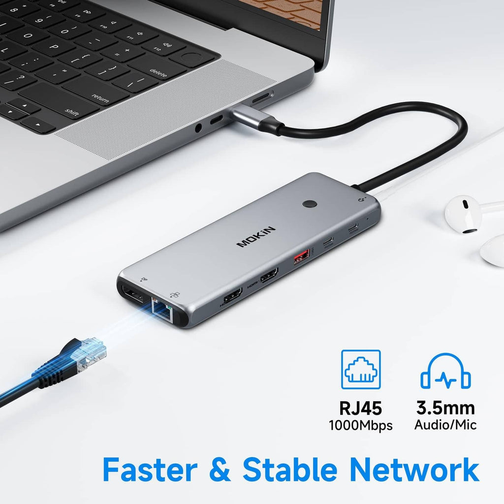 USB-C laptop dock connected to laptop with RJ45 and 3.5mm audio ports