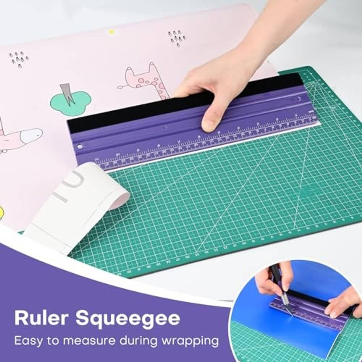 Purple felt ruler squeegee smoothing on a craft surface beside a green cutting mat