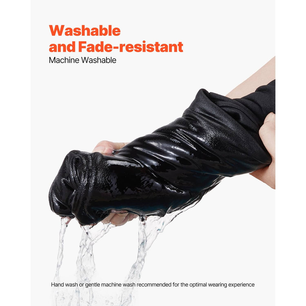 Black fleece hoodie sleeve being wrung out; water droplets over fabric surface