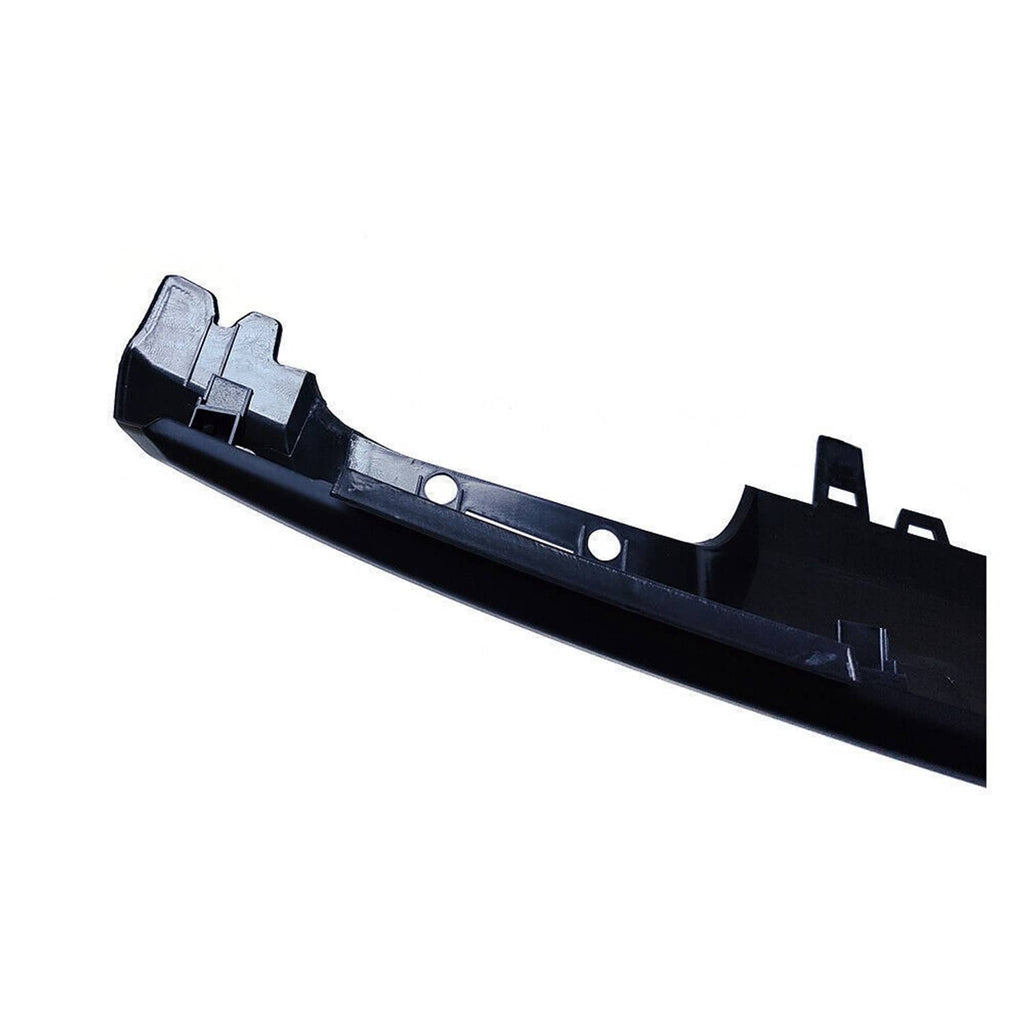 Matte black front bumper lower trim bracket area with mounting tabs and holes