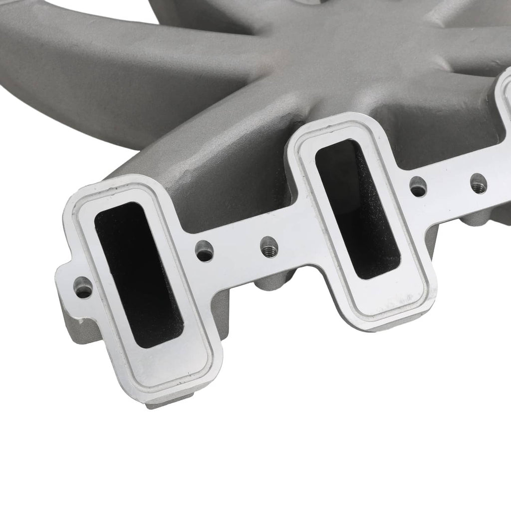 Close-up of gray intake manifold runner ports with white mounting flange and bolt holes