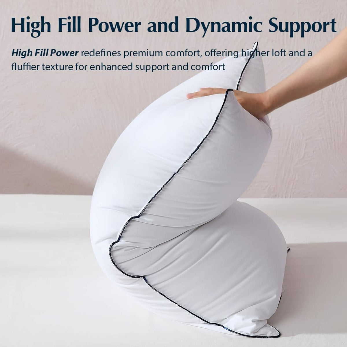White down fiber pillow rolled to show dynamic support, dark edge piping