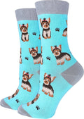 Pair of light blue crew socks with cute yorkie dog and paw print pattern