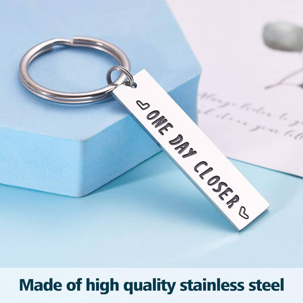 Stainless steel keychain with 'ONE DAY CLOSER' engraving and silver metal ring