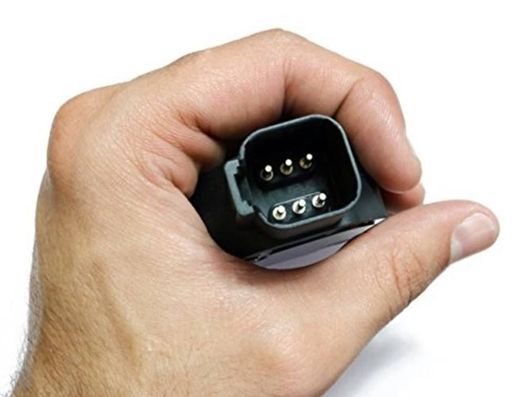 Throttle position sensor held in hand, showing black 6-pin electrical connector
