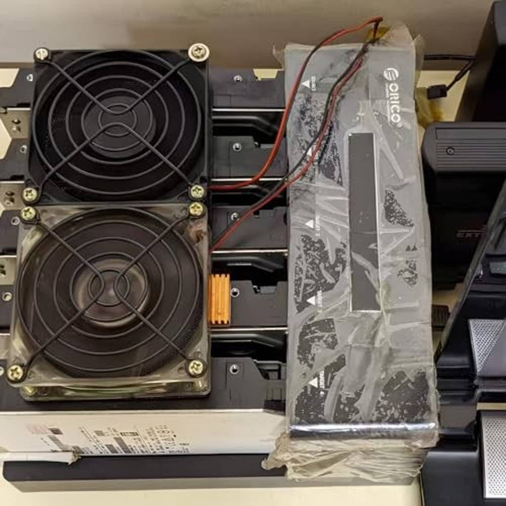 PC interior with dual fan power adapter cables connected to 3/4-pin fan headers
