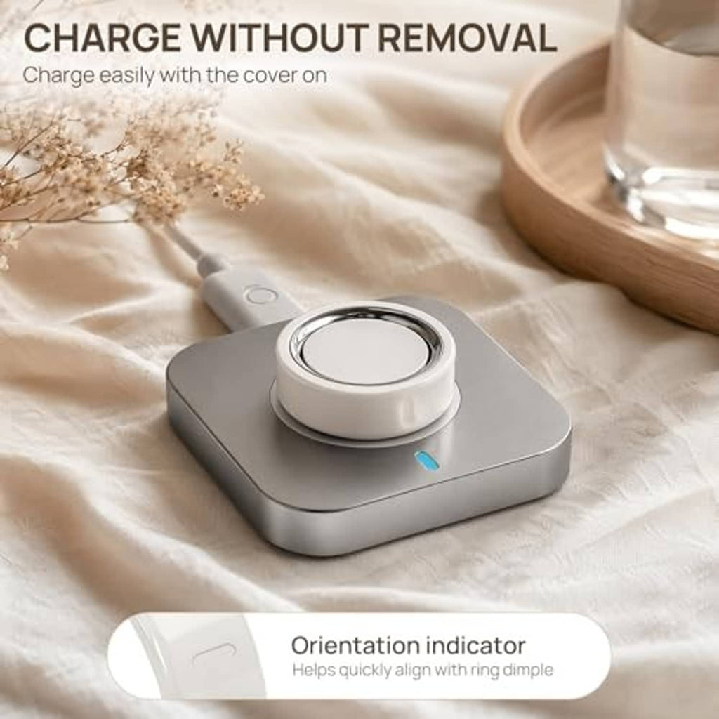 White ring cover placed on a charging station base with a visible alignment mark