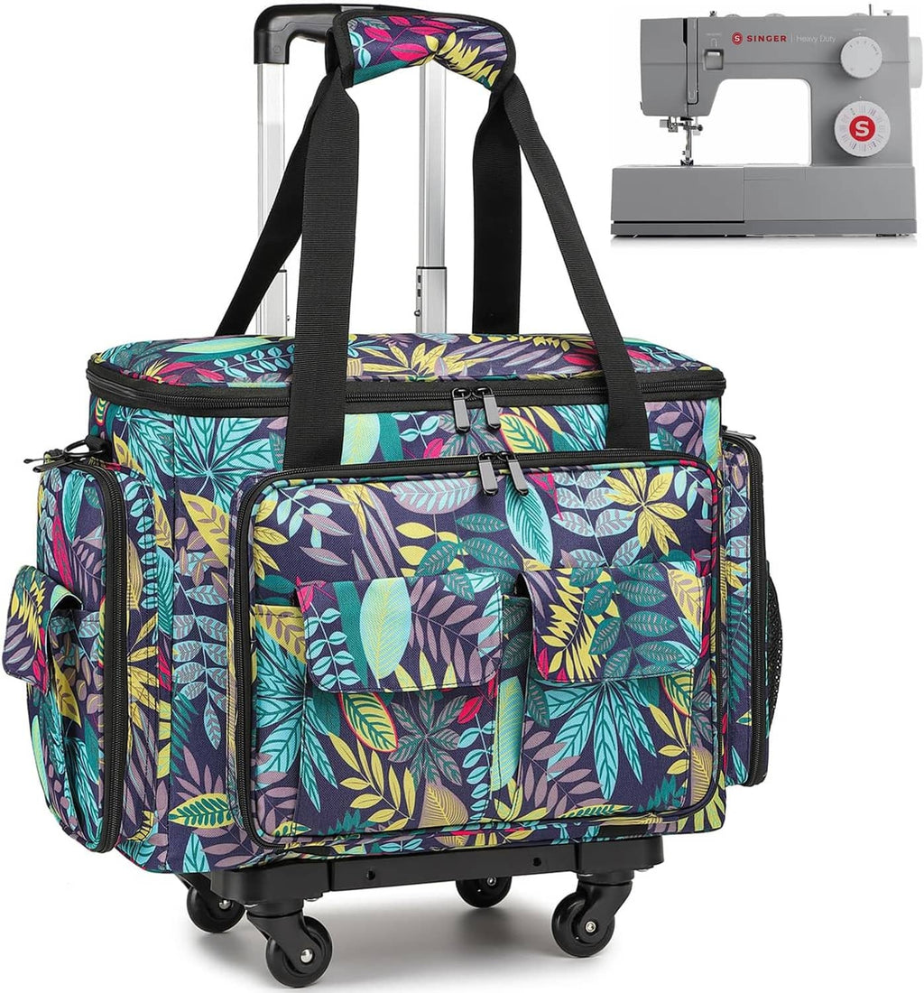 Rolling sewing machine tote bag with colorful leaf print, front pockets, and black wheels