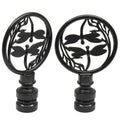 Pair of black dragonfly lamp finials with round medallion designs and threaded bases